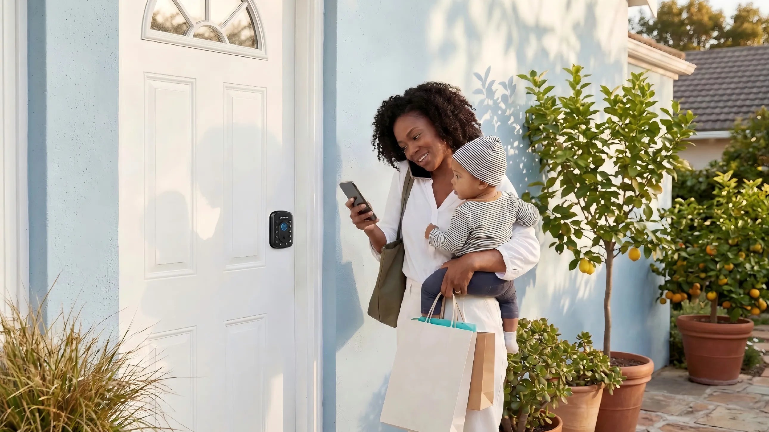 Busy mother holding a baby and shopping bags while using her phone to unlock a SAWHERO smart lock remotely.